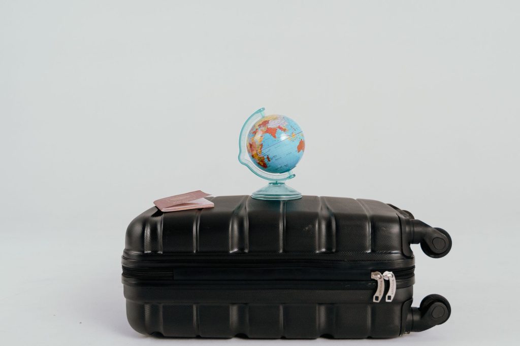 world map travel suitcase flatlay